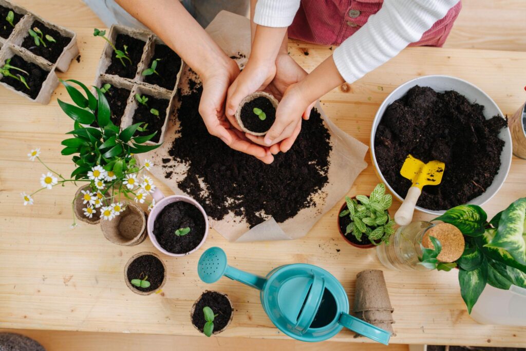 helping our daughters discover their identity - mother daughter hands in flower pot